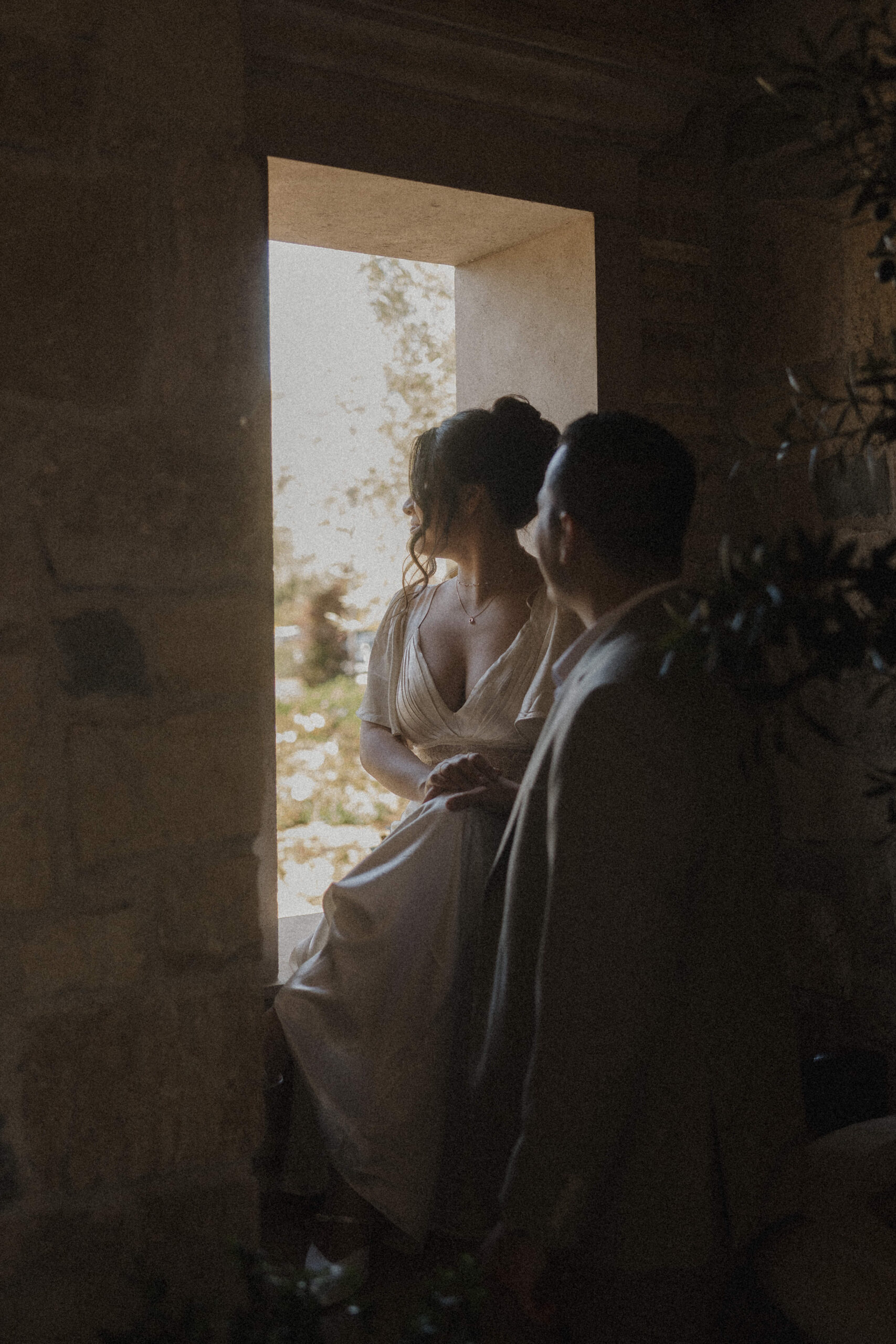Couple sitting in a window looking out